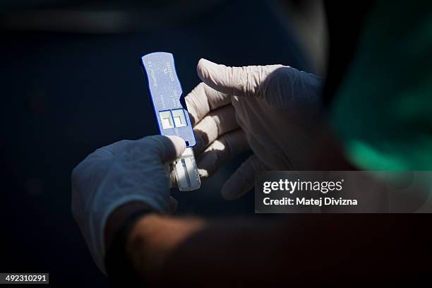 An officer of Bavaria police, with the attendance of officers of Czech police, holds quick test kits for methamphetamine usage while patrolling for...