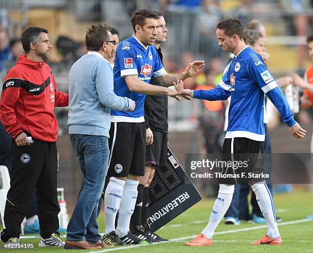 Christian Mueller R) of Bielefeld leaves the pitch for Patrick Schoenfeld during the Second Bundesliga Playoff Second Leg match between Arminia...