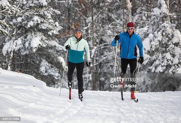 cross country skiing couple - nordic skiing event stock pictures, royalty-free photos & images