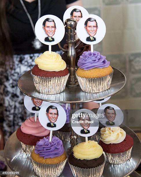 Cupcakes featuring caricatured faces of Prince Charles, Prince of Wales are seen as he visits Seaport Farmer's Market on May 19, 2014 in Halifax,...