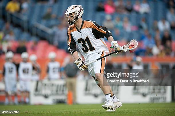 John Ranagan of the Rochester Rattlers runs against the Denver Outlaws during a Major League Lacrosse game at Sports Authority Field at Mile High on...