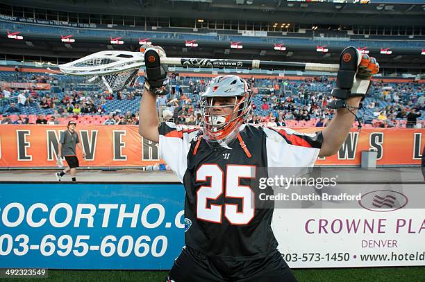 Charlie Cipriano of the Denver Outlaws stretches before a Major League Lacrosse game against the Rochester Rattlers at Sports Authority Field at Mile...