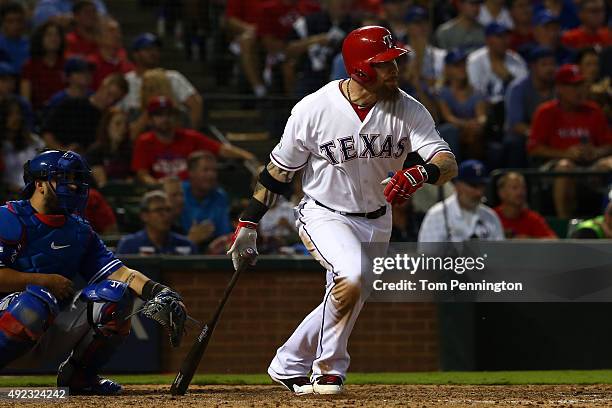Josh Hamilton of the Texas Rangers hits a double in the seventh inning against the Toronto Blue Jays during game three of the American League...