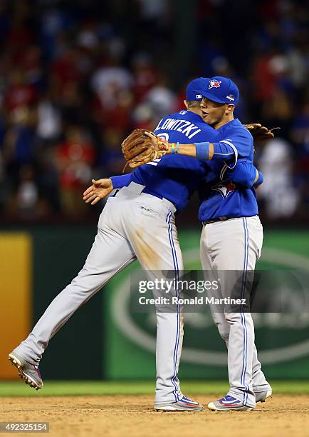 Troy Tulowitzki and Ryan Goins of the Toronto Blue Jays celebrate after defeating the Texas Rangers in game three of the American League Division...