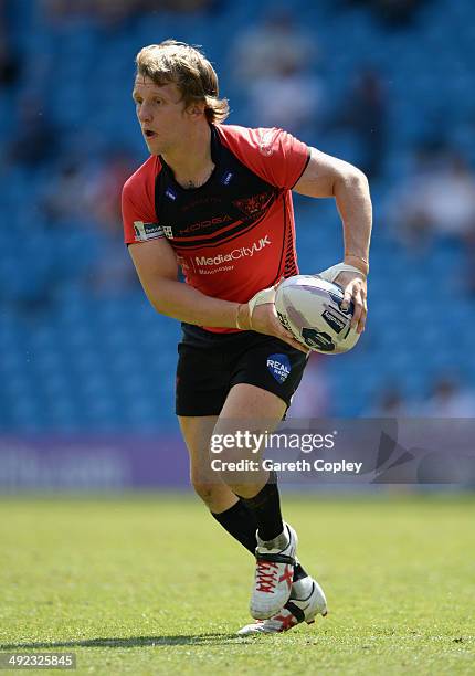 Logan Tomkins of Salford Red Devils in action during the Super League match between Widnes Vikings and Salford Red Devils at Etihad Stadium on May...