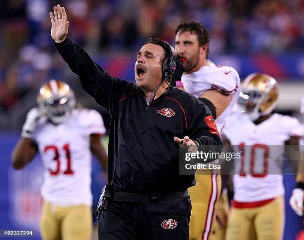 Head coach Jim Tomsula of the San Francisco 49ers directs his players in the fourth quarter against the New York Giants at MetLife Stadium on October...