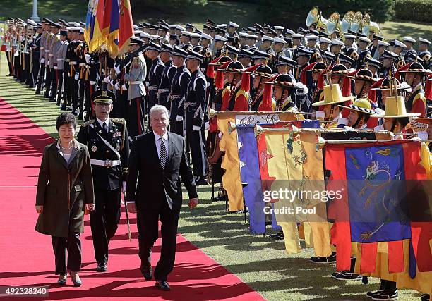 German President Joachim Gauck and South Korean President Park Geun-Hye inspect a honor guard during a welcoming ceremony at the presidential house...