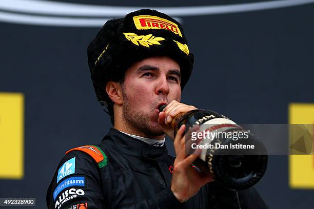 Sergio Perez of Mexico and Force India celebrates on the podium after finishing third in the Formula One Grand Prix of Russia at Sochi Autodrom on...