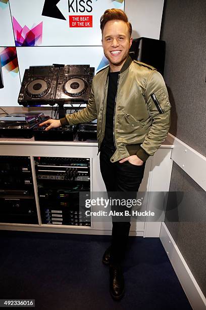 Olly Murs visits Ricky, Melvin and Charlie on Kiss Breakfast at Kiss FM on October 12, 2015 in London, England.