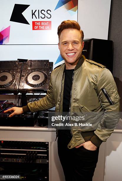 Olly Murs visits Ricky, Melvin and Charlie on Kiss Breakfast at Kiss FM on October 12, 2015 in London, England.