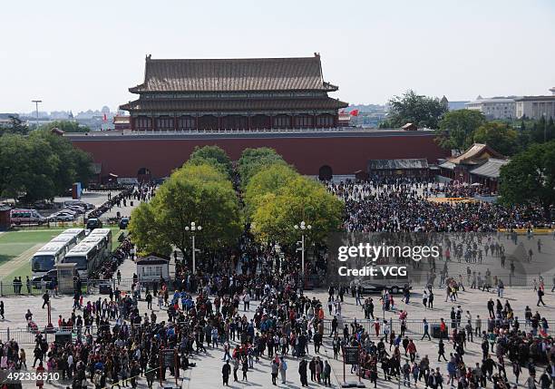Tourists queue to visit a newly opened area inside the Palace Museum on October 11, 2015 in Beijing, China. The Palace Museum opened areas including...