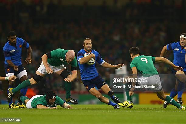 Frederic Michalak of France sidesteps Conor Murray and Paul O'Connell of Ireland during the 2015 Rugby World Cup Pool D match between France and...