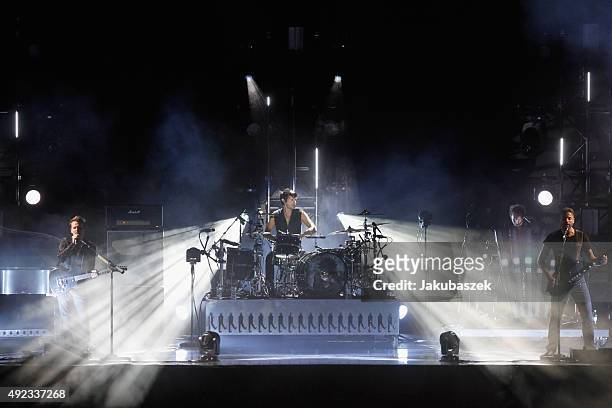 Matthew Bellamy, Dominic Howard and Christopher Wolstenholme of the band Muse perform during the second day of the Lollapalooza Berlin music festival...