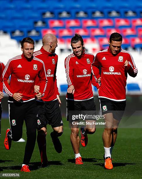 Wales striker Gareth Bale shares a joke with James Collins during Wales training ahead of their match against Andorra at Cardiff City stadium on...