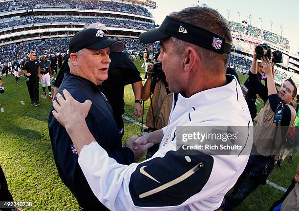 Head coach Chip Kelly, left, of the Philadelphia Eagles greets head coach Sean Payton of the New Orleans Saints after their football game at Lincoln...