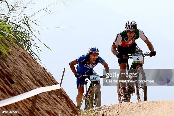 Marco Aurelio Fontana of Italy and Nino Schurter of Switzerland compete in the International Mountain Bike Challenge at the Deodoro Sports Complex on...