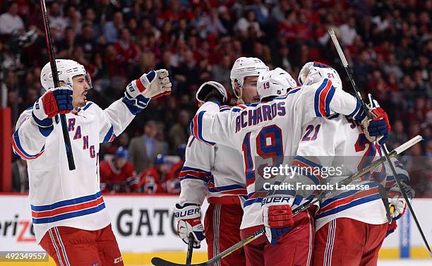 Martin St. Louis of the New York Rangers celebrates with teammates Derek Stepan, Ryan McDonagh, Brad Richards and Chris Kreider after scoring a goal...