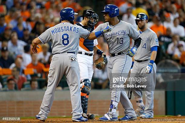 Salvador Perez of the Kansas City Royals celebrates hitting a two run home run in the second inning with Mike Moustakas against the Houston Astros...