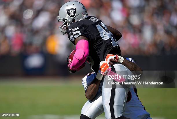 Marcel Reece of the Oakland Raiders carries the ball against the Denver Broncos during the second quarter at the O.co Coliseum on October 11, 2015 in...