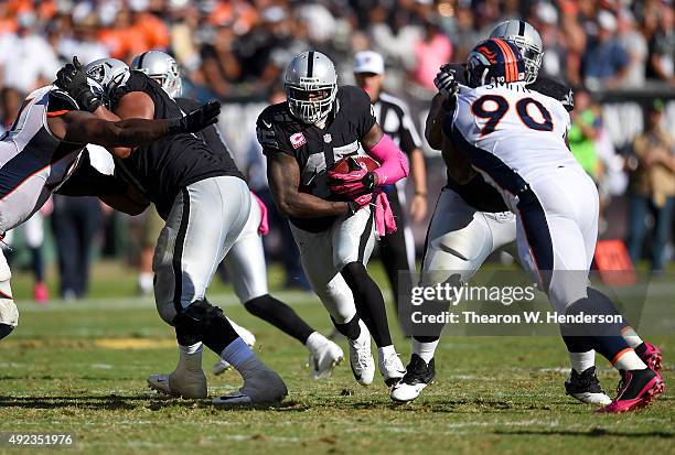 Marcel Reece of the Oakland Raiders rushes with the ball against the Denver Broncos during the fourth quarter at the O.co Coliseum on October 11,...