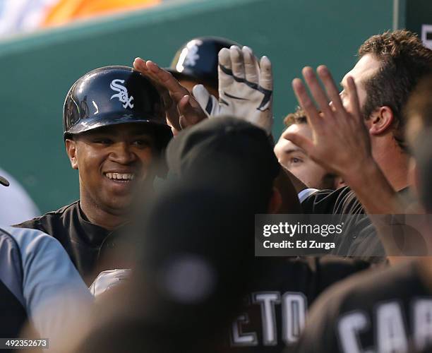 Dayan Viciedo of the Chicago White Sox celebrates with teammates after hitting a home run in the fourth inning against the Kansas City Royals at...