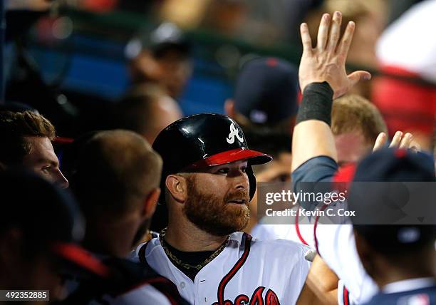 Ryan Doumit of the Atlanta Braves celebrates after hitting a solo homer in the eighth inning against the Milwaukee Brewers at Turner Field on May 19,...