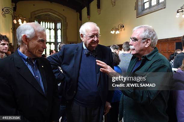 British economist Angus Deaton chats with previous Nobel Prize winners Eric Wieschaus and Chris Sims at Princeton University in Princeton, New...