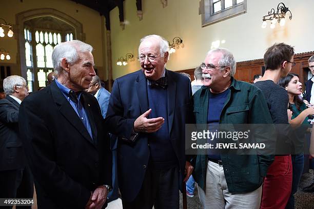British economist Angus Deaton chats with previous Nobel Prize winners Eric Wieschaus and Chris Sims at Princeton University in Princeton, New...