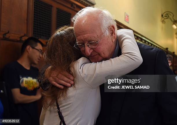 British economist Angus Deaton is congratulated for winning the Nobel Prize at Princeton University in Princeton, New Jersey, on October 12, 2015....