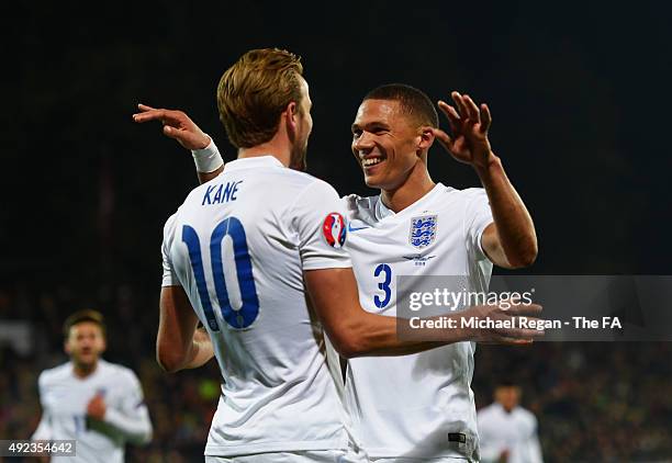 Harry Kane of England celebrates with Kieran Gibbs of England as his shot rebounds off goalkeeper Giedrius Arlauskis of Lithuania for an own goal and...