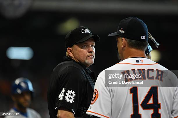 Manager A.J. Hinch of the Houston Astros challenges the Terrance Gore of the Kansas City Royals safe call at third base on an attempted steal during...