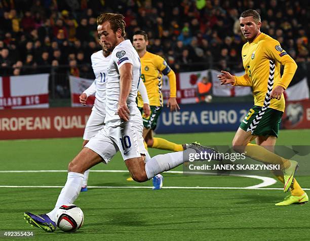 England's Harry Kane scores a goal next to Lithuania's Georgas Fredgeimas during the Euro 2016 Group E qualifying football match between Lithuania...