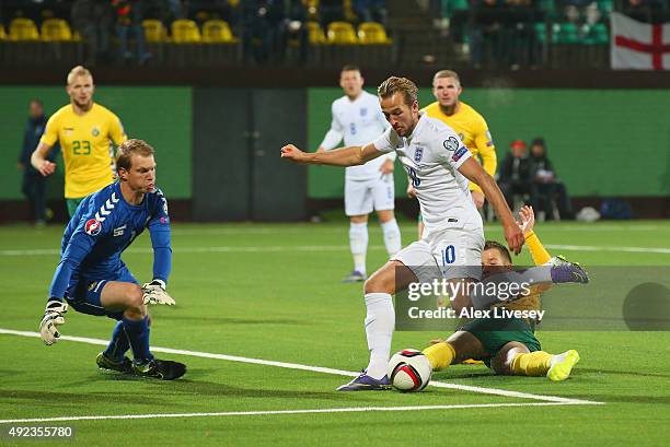 Harry Kane of England is faced by goalkeeper Giedrius Arlauskis of Lithuania during the UEFA EURO 2016 qualifying Group E match between Lithuania and...