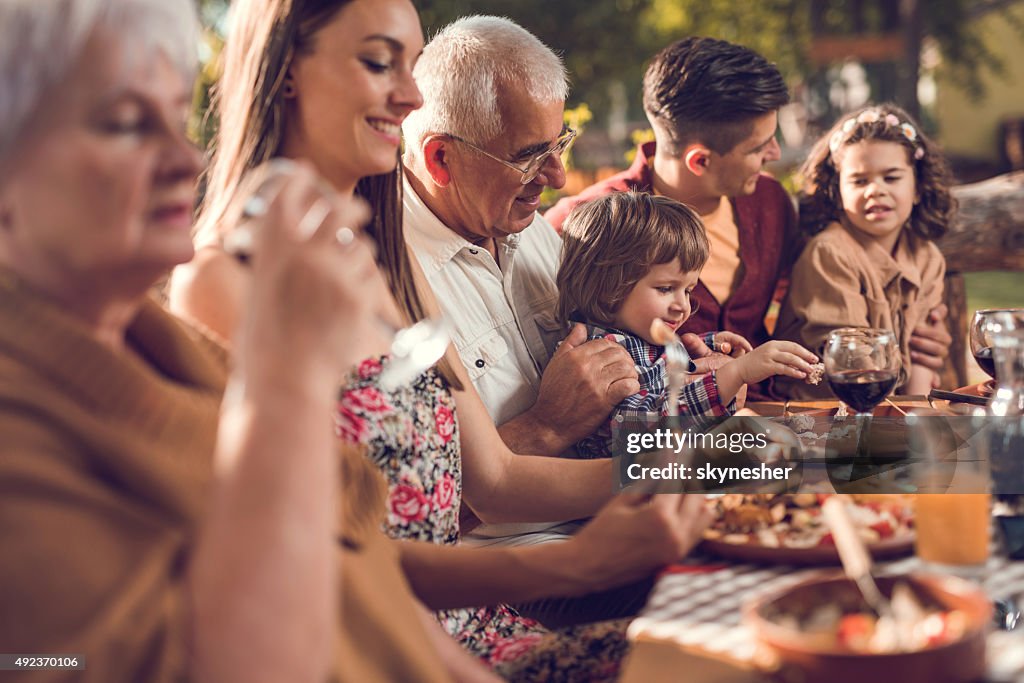 Extended family eating in restaurant.