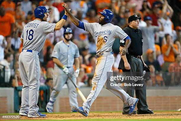 Lorenzo Cain of the Kansas City Royals scores on an error by Carlos Correa of the Houston Astros in the eighth inning during game four of the...