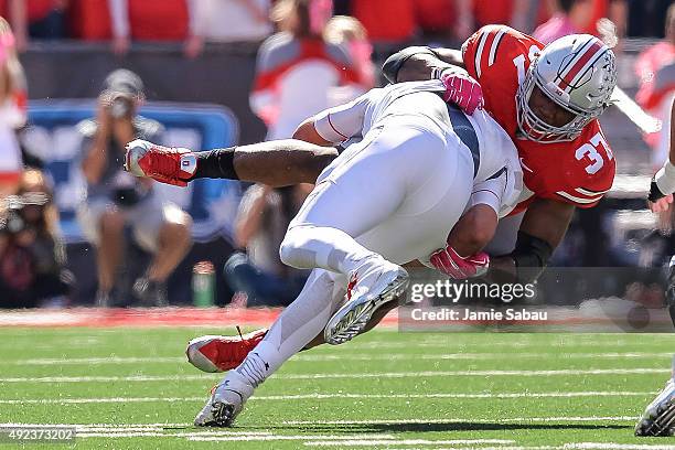 Joshua Perry of the Ohio State Buckeyes sacks quarterback Perry Hills of the Maryland Terrapins at Ohio Stadium on October 10, 2015 in Columbus, Ohio.