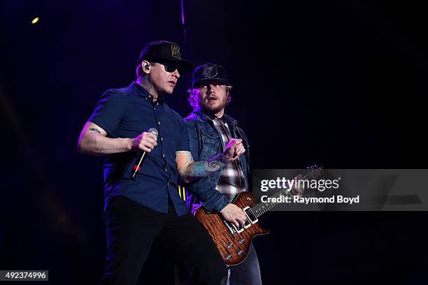 Singer Brent Smith and musician Zach Myers from Shinedown performs during the 'Louder Than Life' festival at Champions Park on October 4, 2015 in...