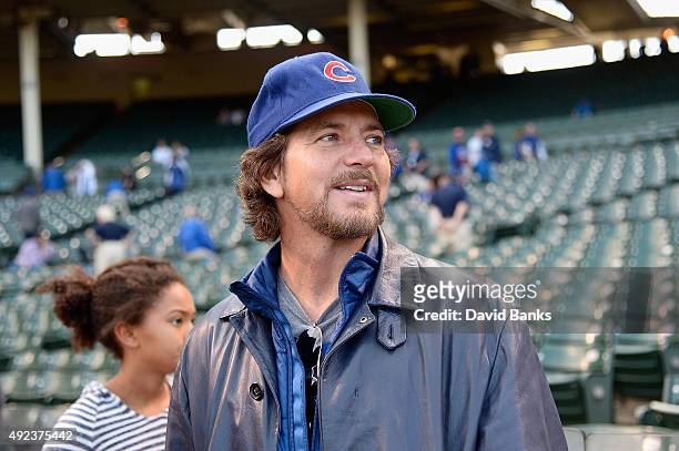 Musician Eddie Vedder watches batting practice prior to game three of the National League Division Series between the Chicago Cubs and the St. Louis...