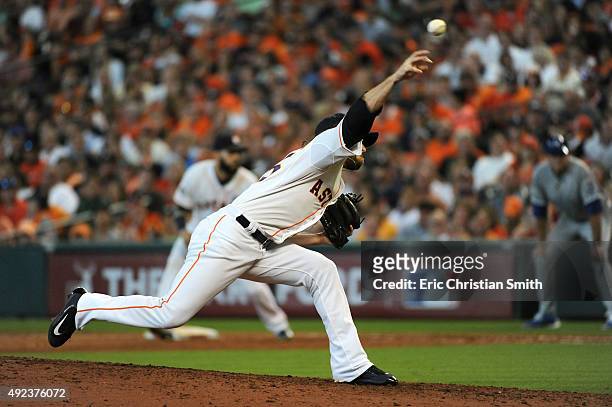 Josh Fields of the Houston Astros pitches in the ninth inning against the Kansas City Royals during game four of the American League Divison Series...