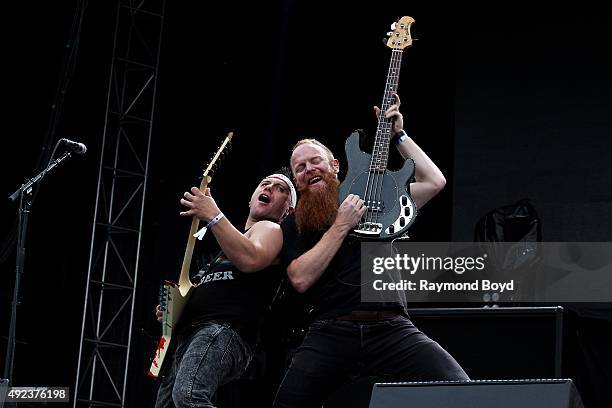 Musicians Dan Jacobs and Marc McKnight from Atreyu performs during the 'Louder Than Life' festival at Champions Park on October 3, 2015 in...