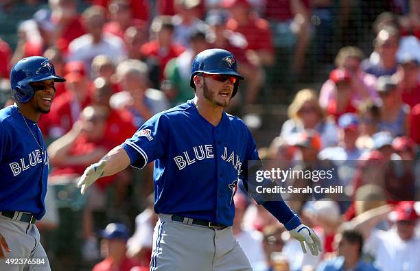 Josh Donaldson of the Toronto Blue Jays celebrates after hitting a two-run home run in the top of the first inning of Game 4 of the ALDS against the...