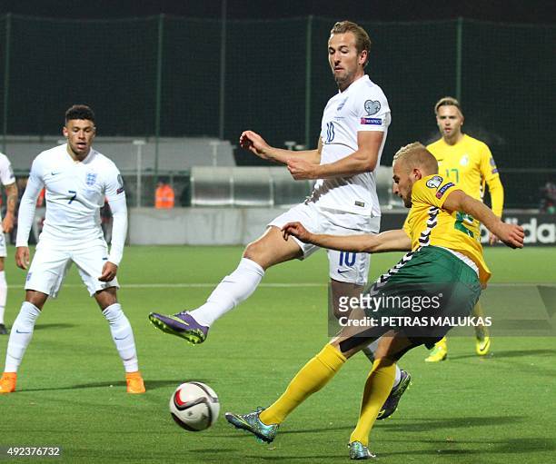 England's forward Harry Kane and Lithuania's defender Fiodor Cernych vie for the ball during the Euro 2016 Group E qualifying football match between...