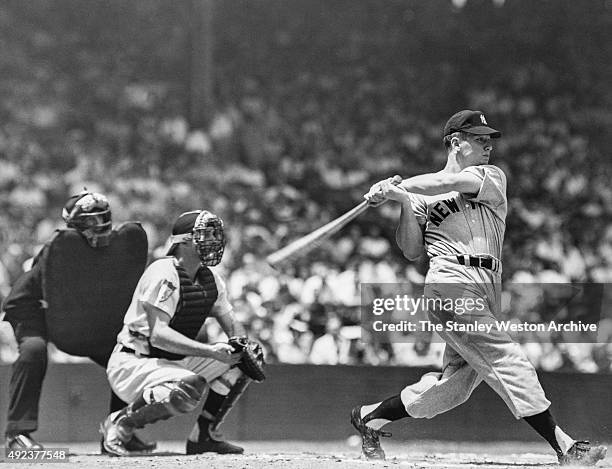 Mickey Mantle of the New York Yankees hits a home run during an MLB game circa 1956.