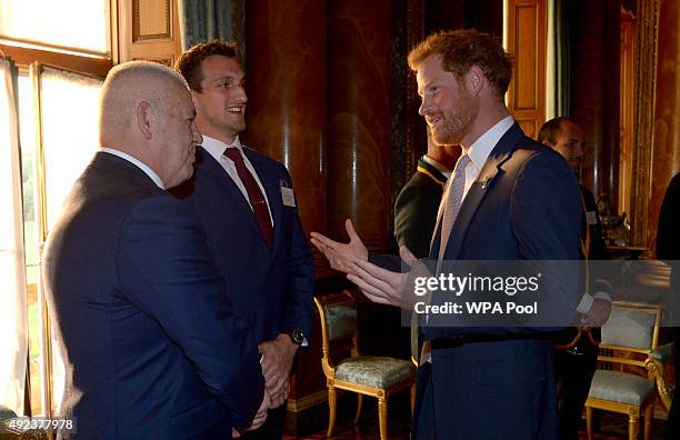 Prince Harry meets Wales' Rugby Union Captain Sam Warburton and Wales' head coach Warren Gatland at a reception at Buckingham Palace to welcome Rugby...