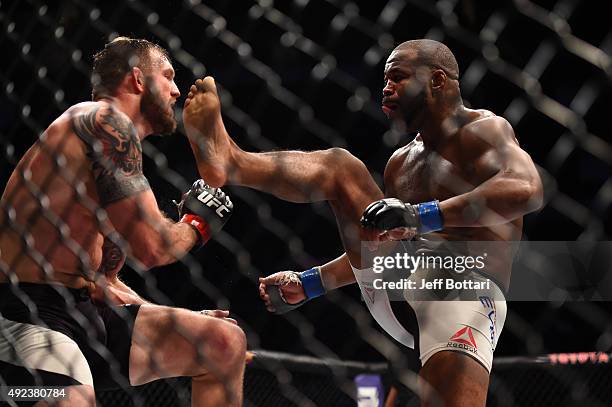 Rashad Evans looks to kick Ryan Bader in their light heavyweight bout during the UFC 192 event at the Toyota Center on October 3, 2015 in Houston,...