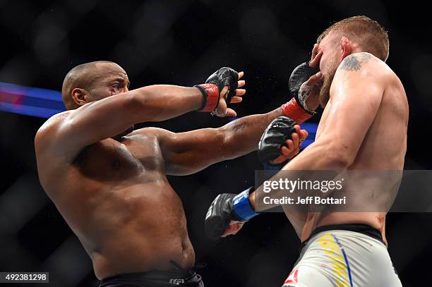 Daniel Cormier blocks a punch attack from Alexander Gustafsson in their UFC light heavyweight championship bout during the UFC 192 event at the...