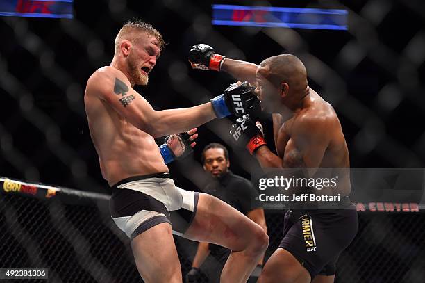 Daniel Cormier punches Alexander Gustafsson in their UFC light heavyweight championship bout during the UFC 192 event at the Toyota Center on October...