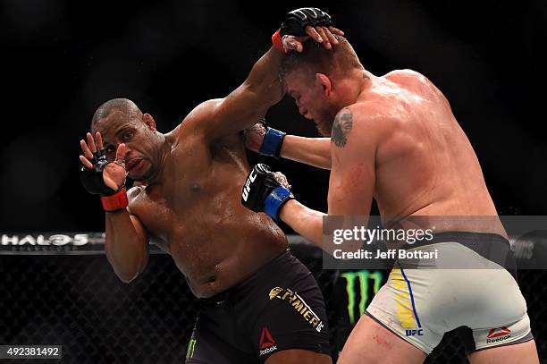 Alexander Gustafsson punches Daniel Cormier in their UFC light heavyweight championship bout during the UFC 192 event at the Toyota Center on October...