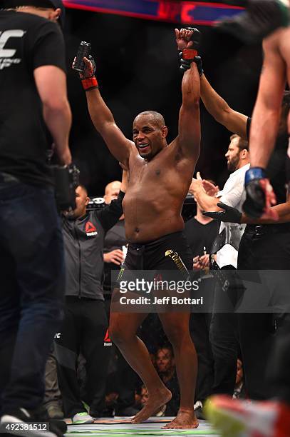 Daniel Cormier celebrates after defeating Alexander Gustafsson in their UFC light heavyweight championship bout during the UFC 192 event at the...