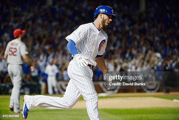 Kris Bryant of the Chicago Cubs runs the bases after hitting a two-run home run in the fifth inning against the St. Louis Cardinals during game three...